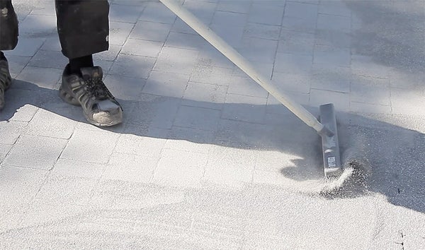 Cleaning concrete pavers